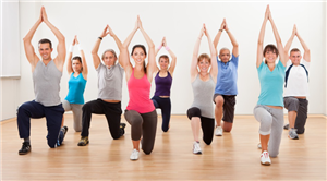 people doing yoga in a gym